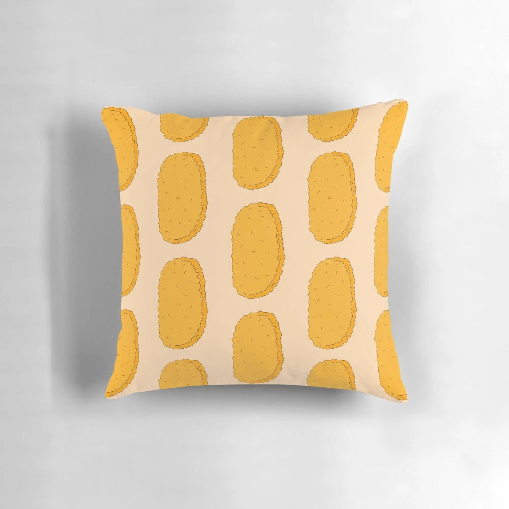 A colorful, cartoon-inspired hash brown doodle pillow with a playful, brown and orange design.