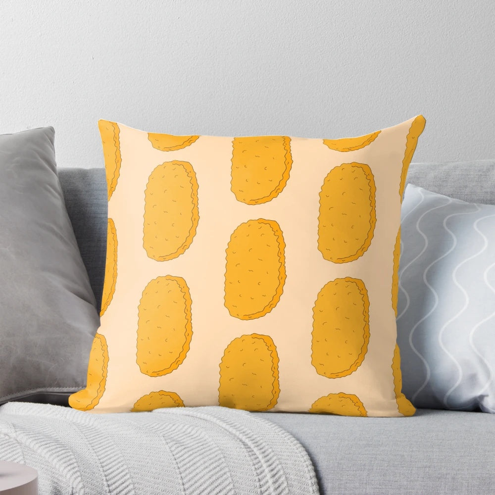 A colorful, cartoon-inspired hash brown doodle pillow with a playful, brown and orange design.