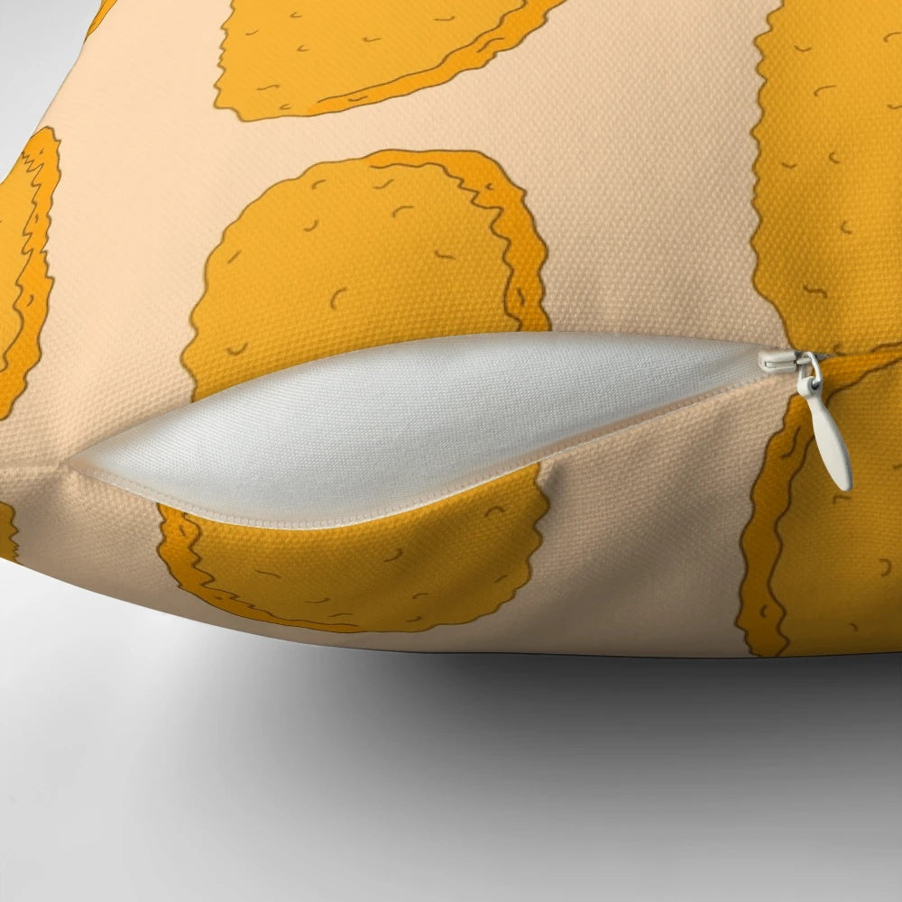 A colorful, cartoon-inspired hash brown doodle pillow with a playful, brown and orange design.