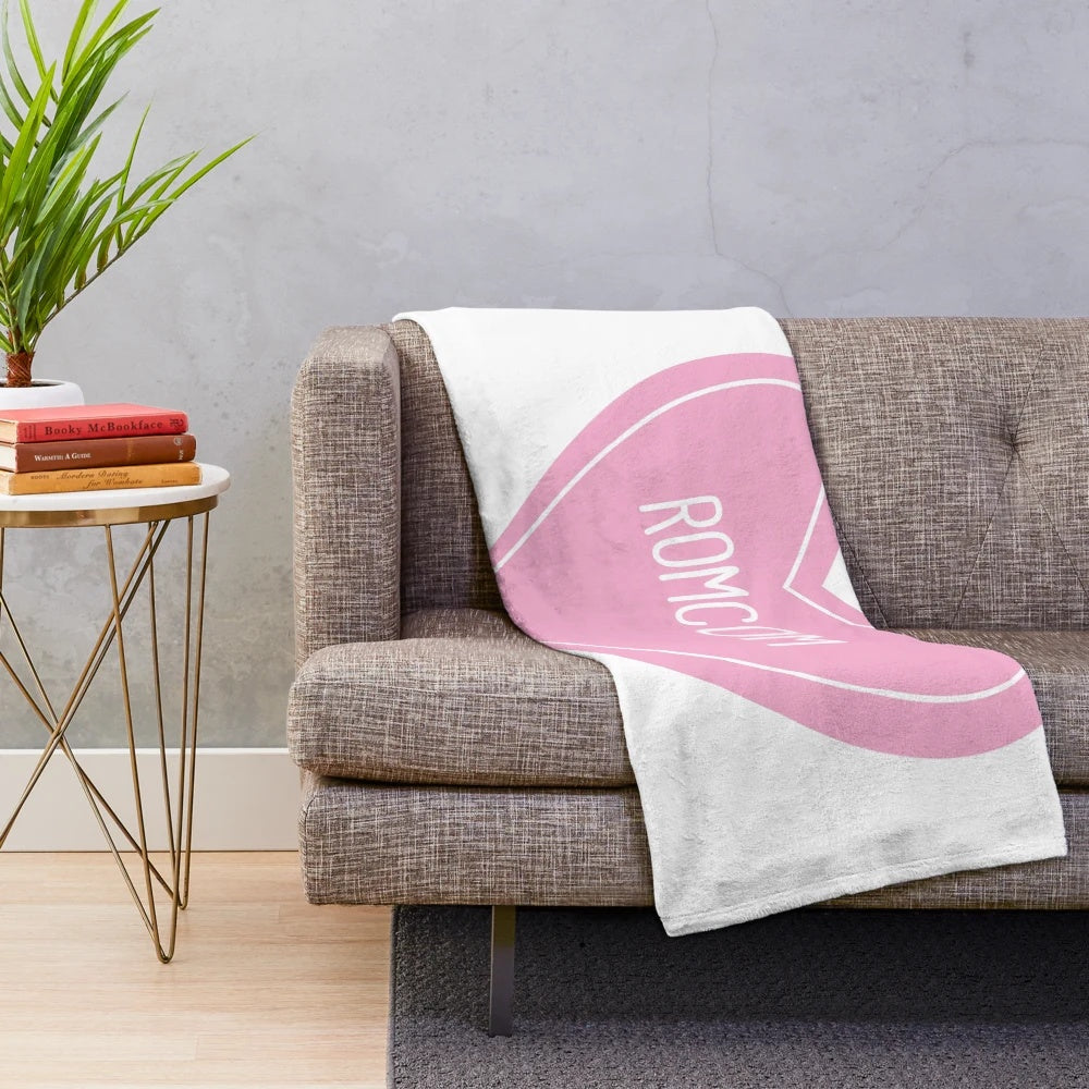 Soft, heart-shaped plush blanket perfect for romantic comedy lovers