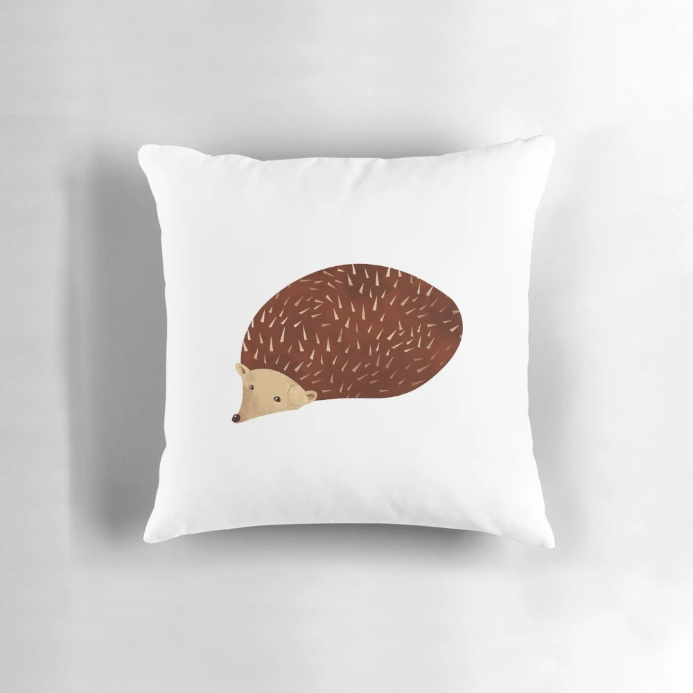 Soft, plush hedgehog-shaped pillow in a natural woodland design for nature-inspired home accents