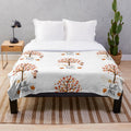 Cozy plush blanket with autumn leaf design