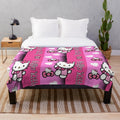 Soft and plush pink blanket with a Hello Kitty inspired design