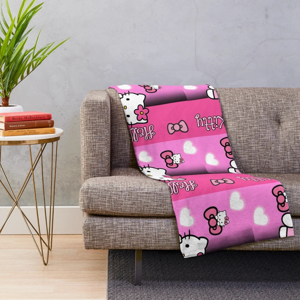 Soft and plush pink blanket with a Hello Kitty inspired design