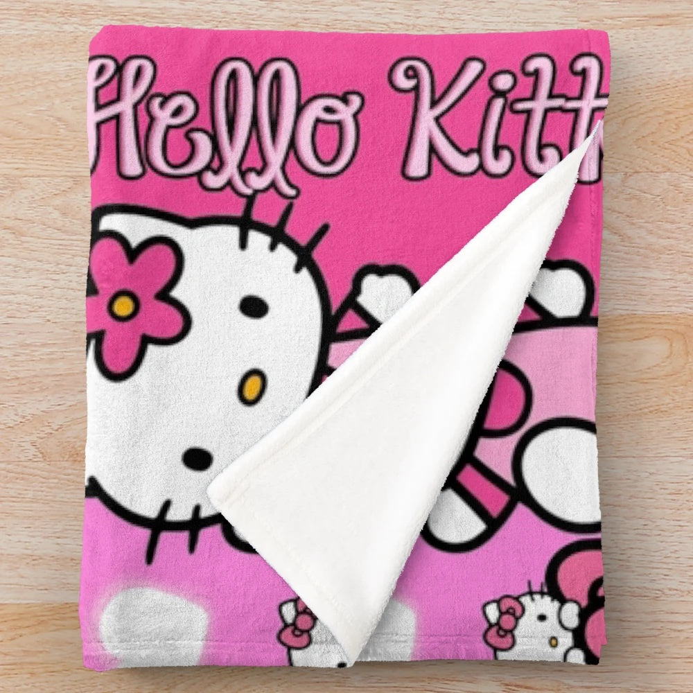 Soft and plush pink blanket with a Hello Kitty inspired design