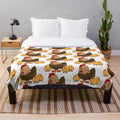 Soft and cuddly plush blanket with a charming hen and chickens pattern, perfect for farmhouse style decor