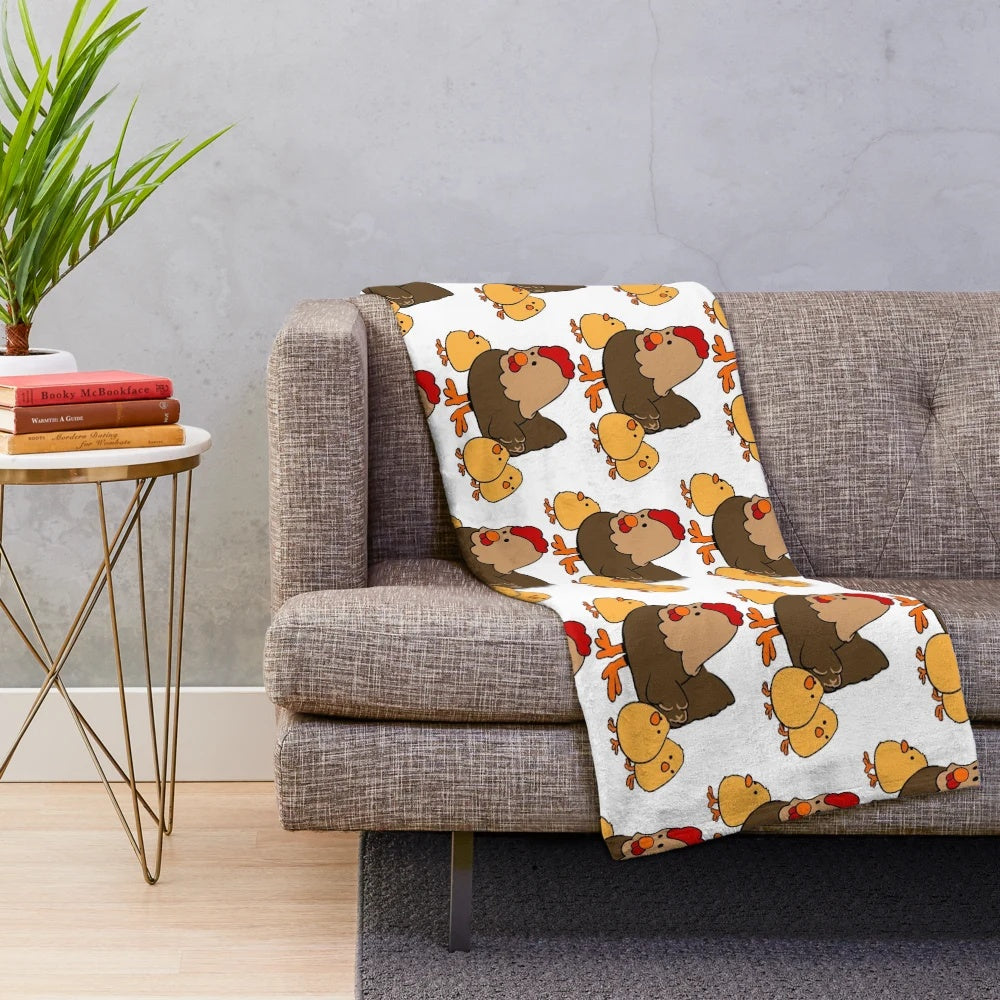 Soft and cuddly plush blanket with a charming hen and chickens pattern, perfect for farmhouse style decor