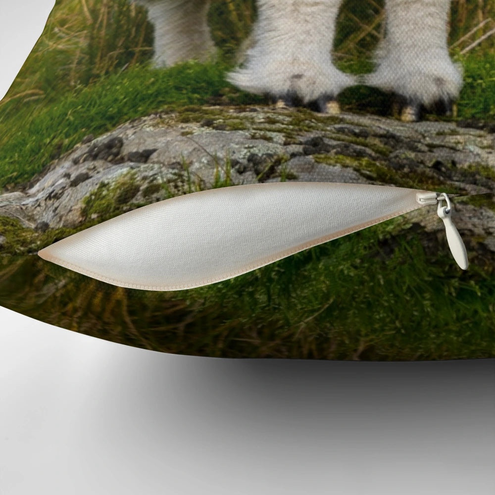 A grey and white herdwick sheep pillow, perfect for any sheep lover or farm decor.