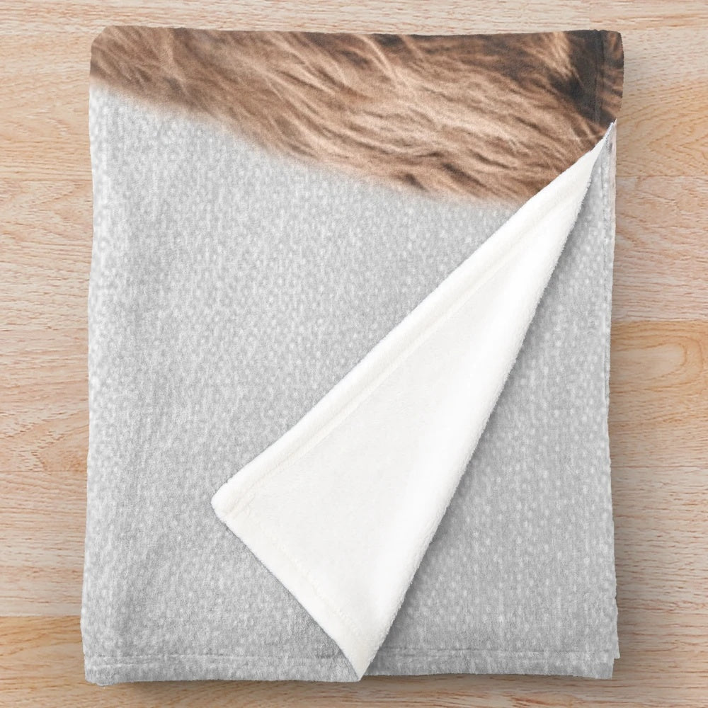 Soft and cuddly plush blanket featuring a cute highland calf design
