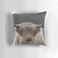 A plush, high-quality pillow featuring a realistic highland cattle design, perfect for adding a rustic, farmhouse touch to your home decor.