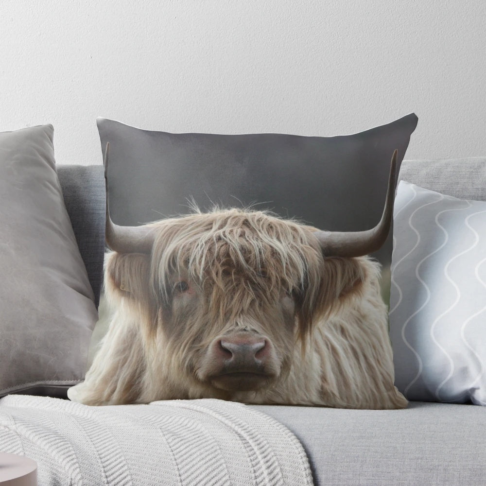 A plush, high-quality pillow featuring a realistic highland cattle design, perfect for adding a rustic, farmhouse touch to your home decor.