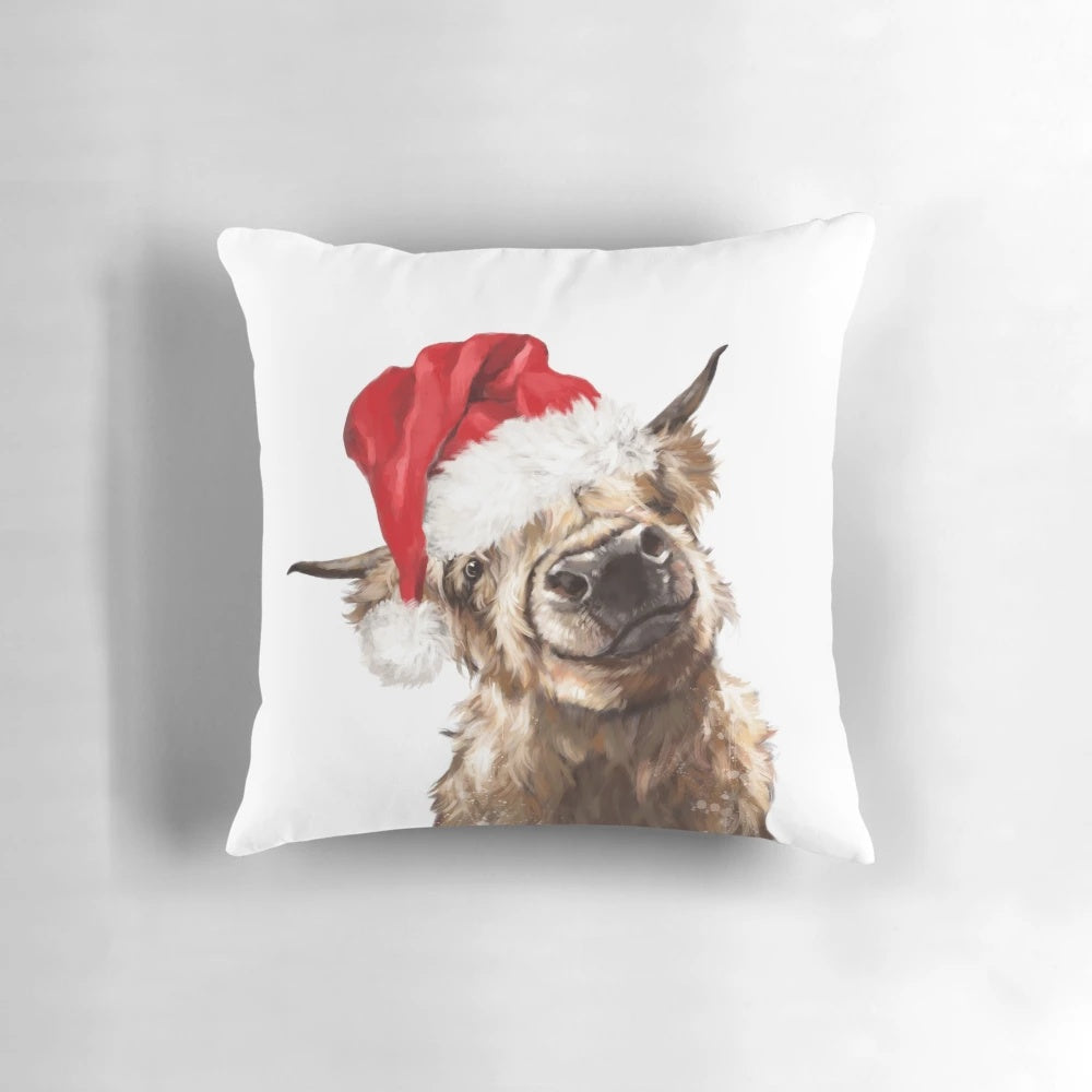 Soft, plush Highland cow Christmas pillow with festive holiday design
