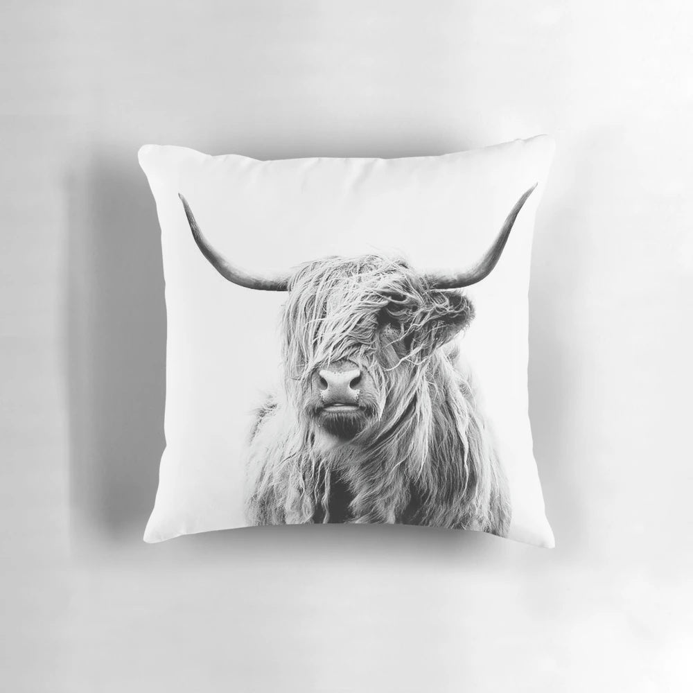 A black and white highland cow decorative pillow for home decor
