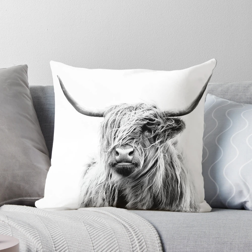 A black and white highland cow decorative pillow for home decor