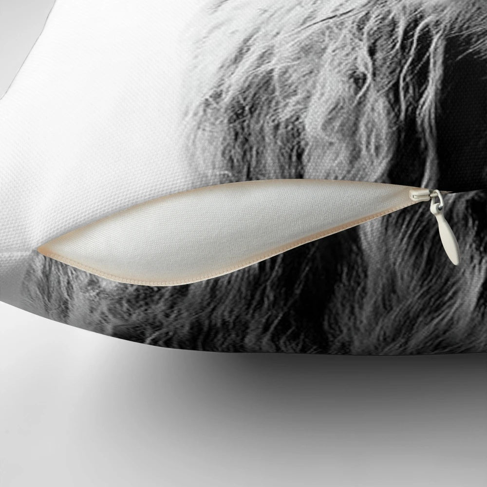 A black and white highland cow decorative pillow for home decor