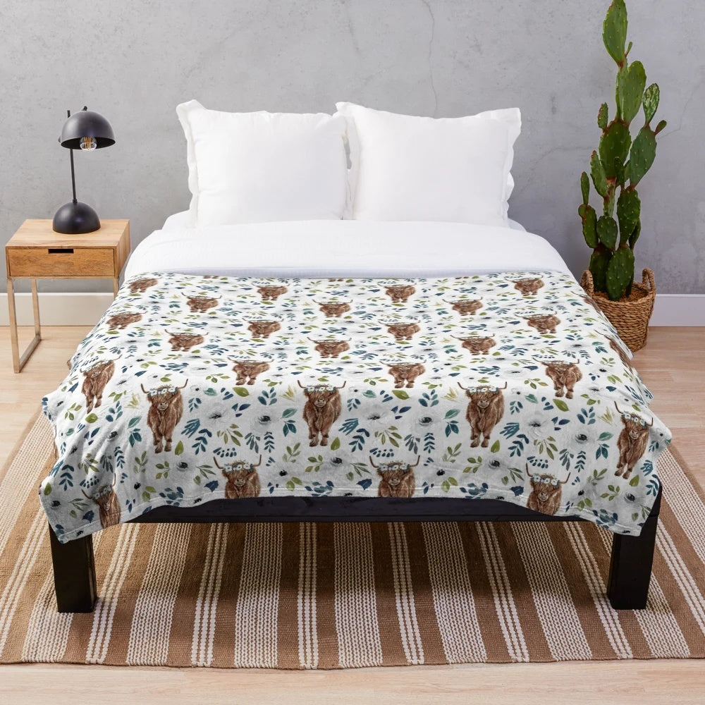 Plush blanket featuring a highland cow with a floral crown design