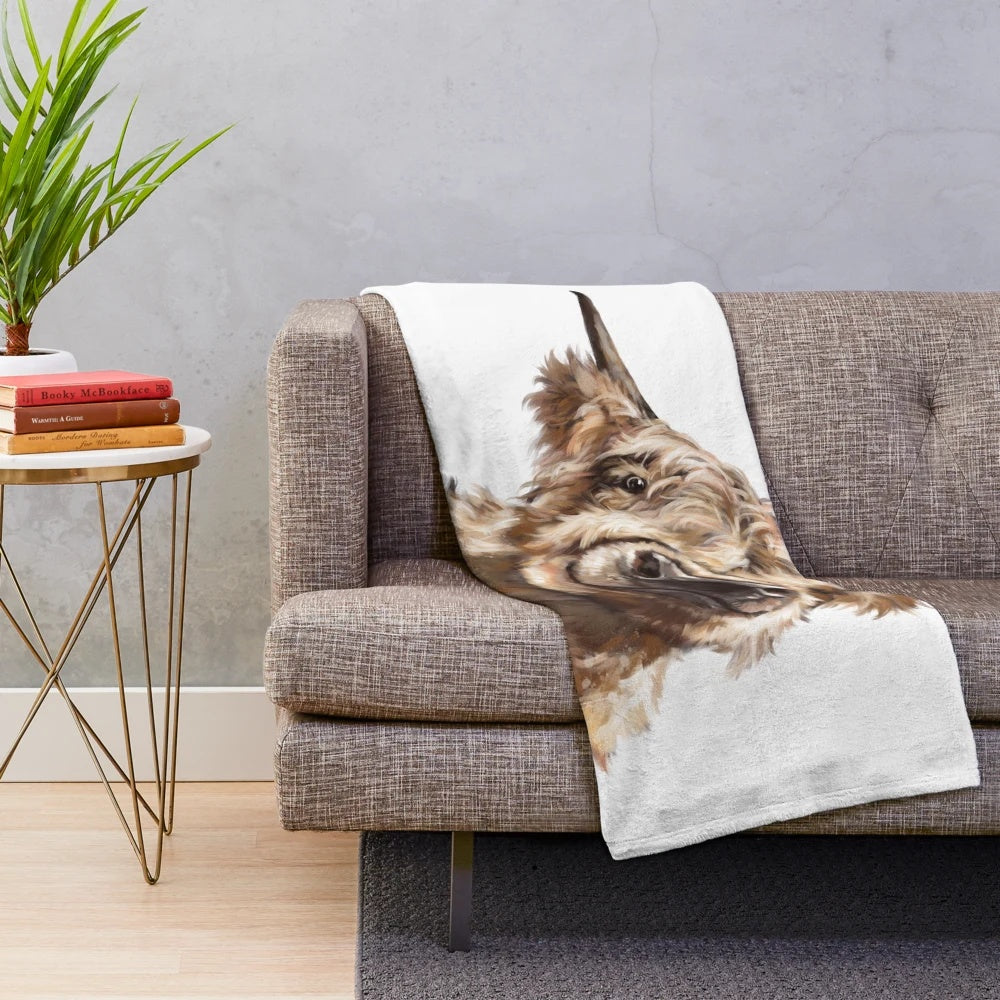 Highland cow plush blanket with soft, furry texture