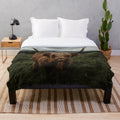 Highland cow plush blanket in a cozy, soft fabric