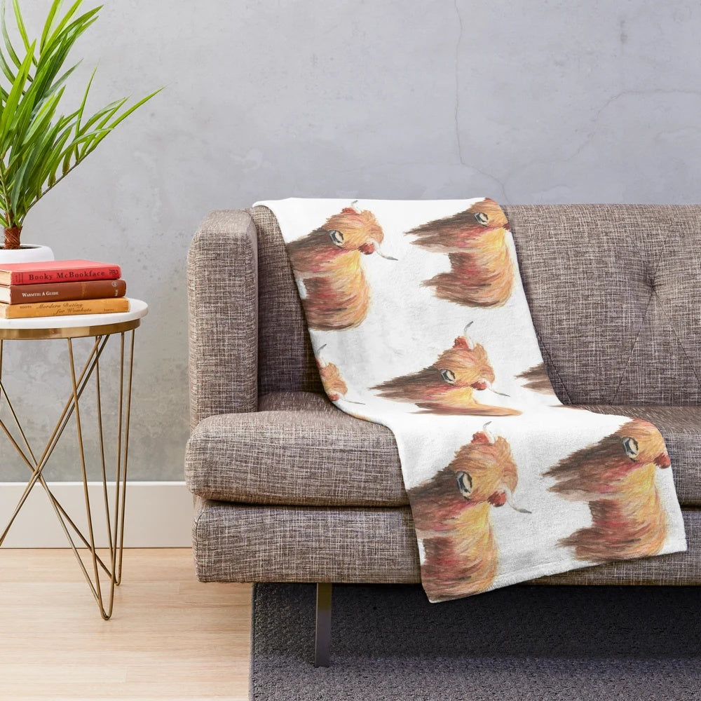 Soft and cuddly highland cow plush blanket with a watercolor design