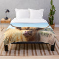 Tongue out Highland cow plush blanket