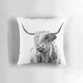 A cozy and rustic highland cow portrait depicted on a soft pillow for home decor.