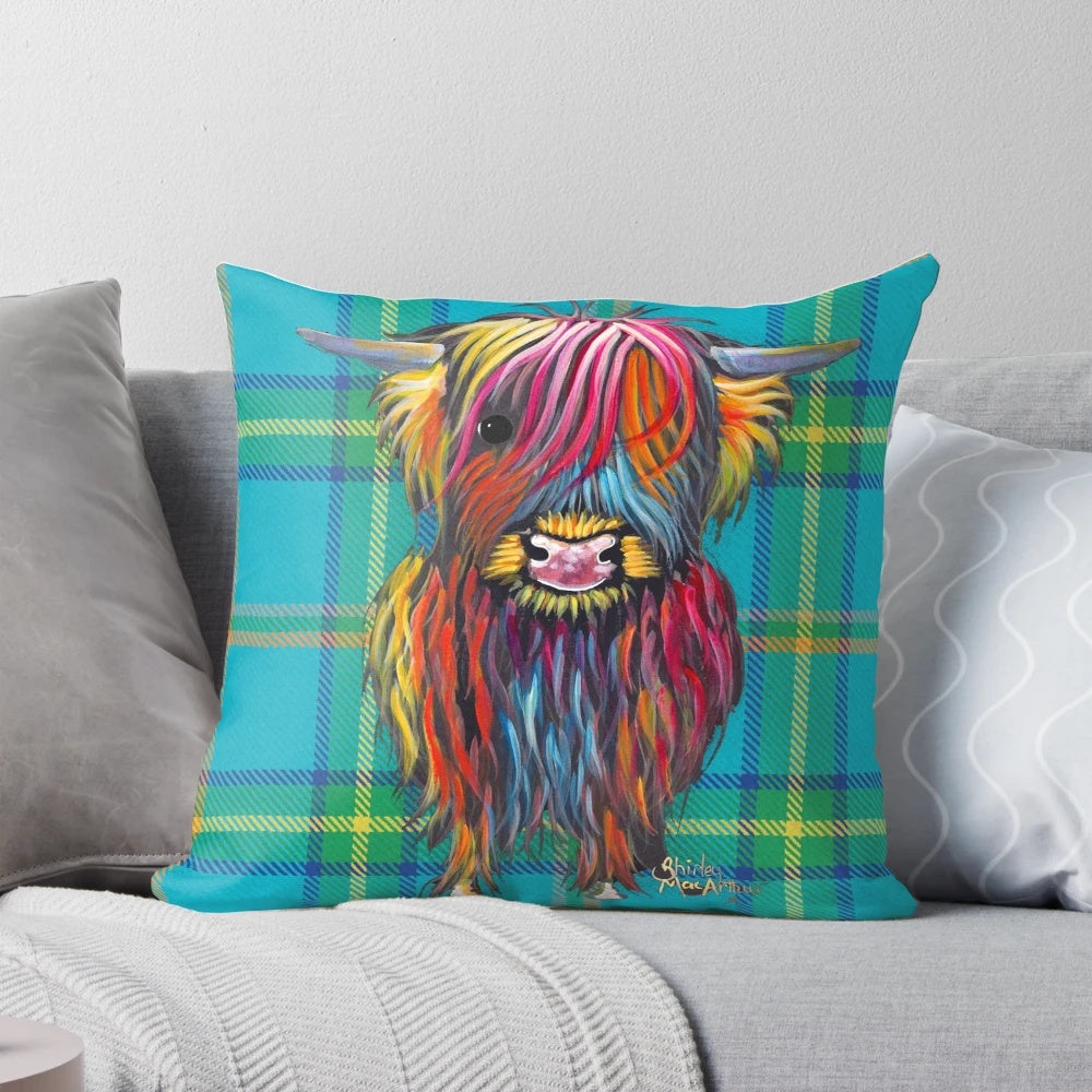 Colorful tartan pattern pillow featuring a friendly highland cow design