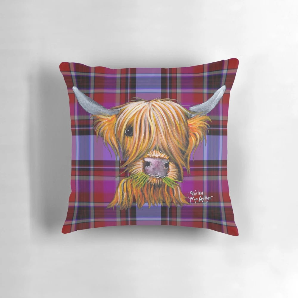 A soft, plush pillow featuring a highland cow in a tartan pattern with a galaxy-inspired background.