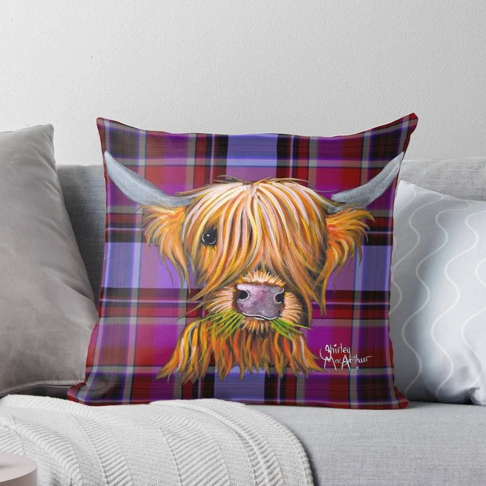A soft, plush pillow featuring a highland cow in a tartan pattern with a galaxy-inspired background.