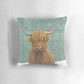 A plush, high-quality pillow featuring a highland cow in a snowy tartan pattern with robins.