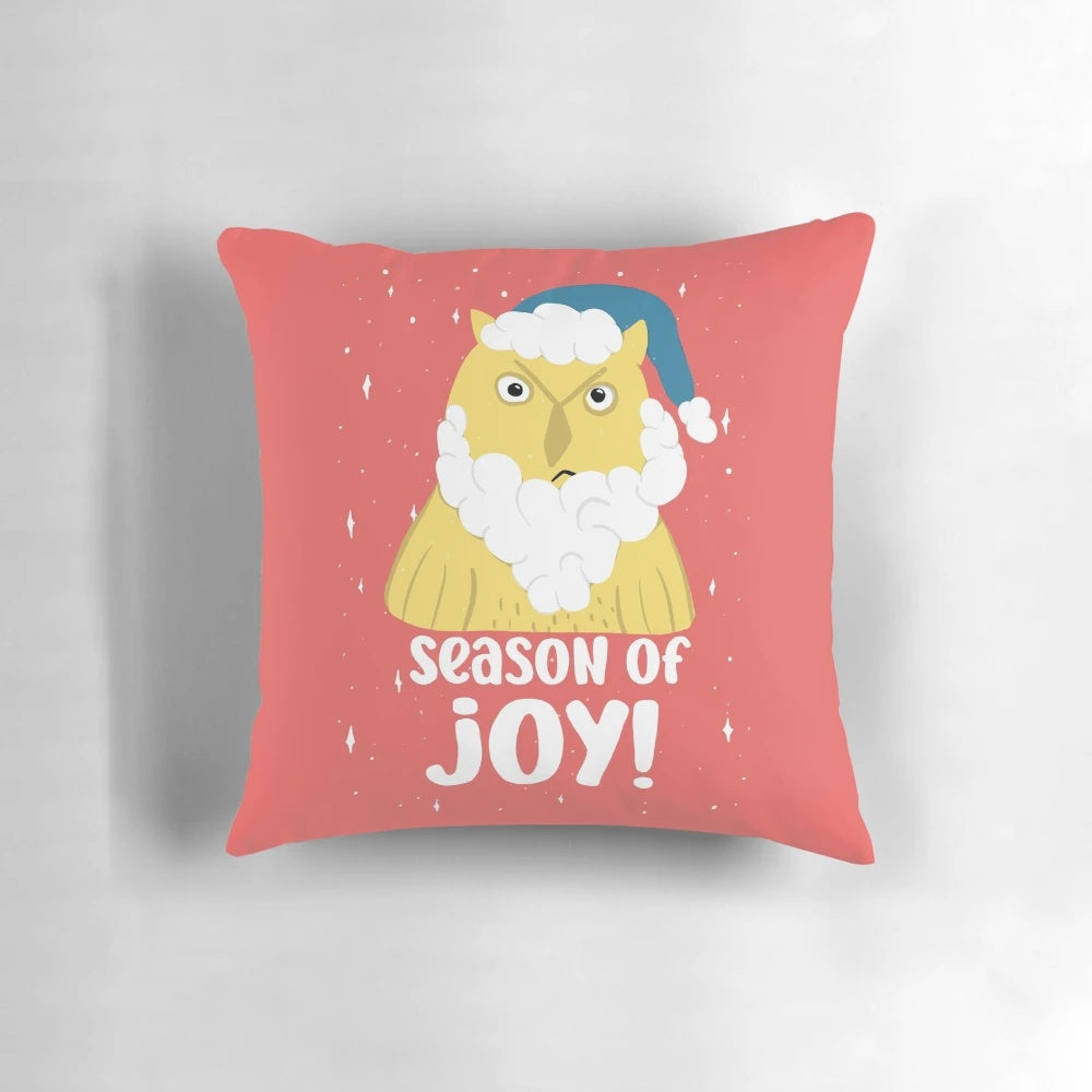 A decorative throw pillow featuring a grumpy-looking Santa owl on a winter-themed background.
