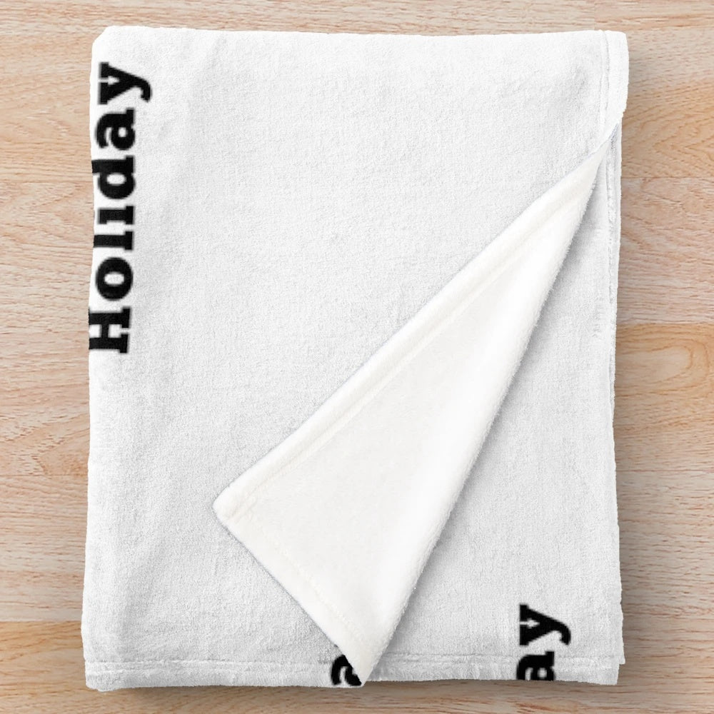 Holiday-themed plush blanket with elegant text design