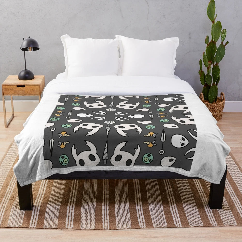 Hollow Knight 10" plush blanket featuring the iconic knight and ghost characters
