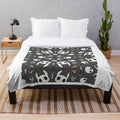 Hollow Knight 10" plush blanket featuring the iconic knight and ghost characters