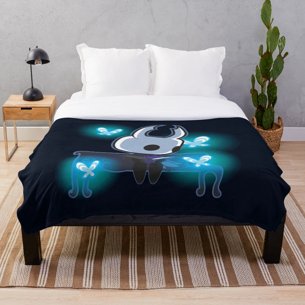 Hollow Knight themed plush blanket featuring the game's iconic butterflies