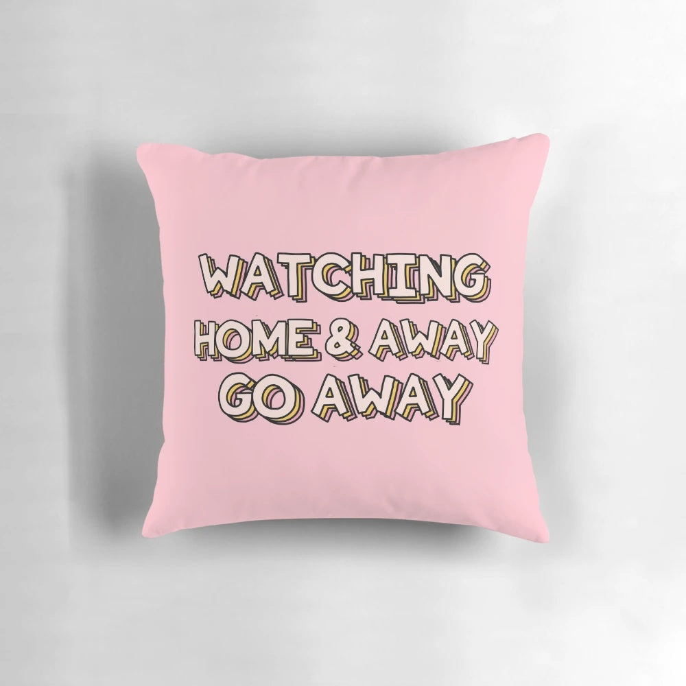 A plush pillow featuring the text "Go Away" on a background reminiscent of the Australian TV show Home and Away.