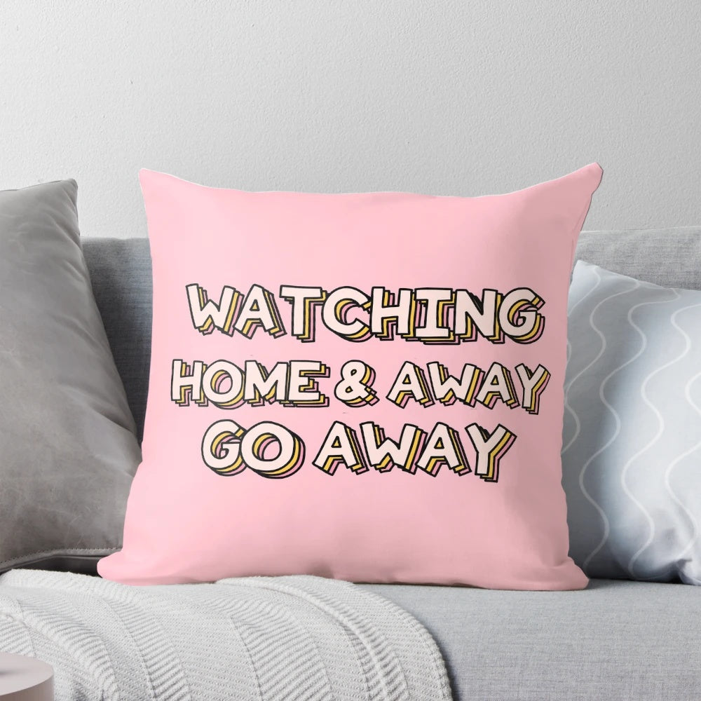 A plush pillow featuring the text "Go Away" on a background reminiscent of the Australian TV show Home and Away.