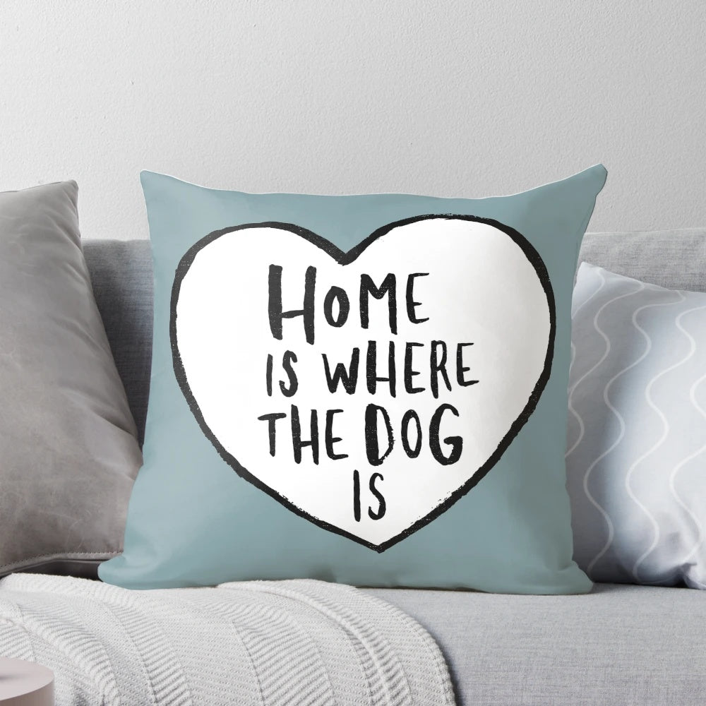 Soft, plush home decor pillow with a heart shape design and the text "Home is Where the Dog Is" for dog owners and animal lovers.