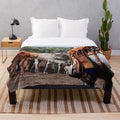 A soft and plush blanket featuring horses and cattle for rustic farmhouse style