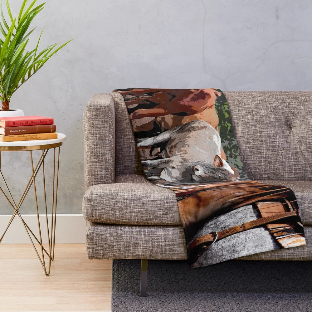A soft and plush blanket featuring horses and cattle for rustic farmhouse style