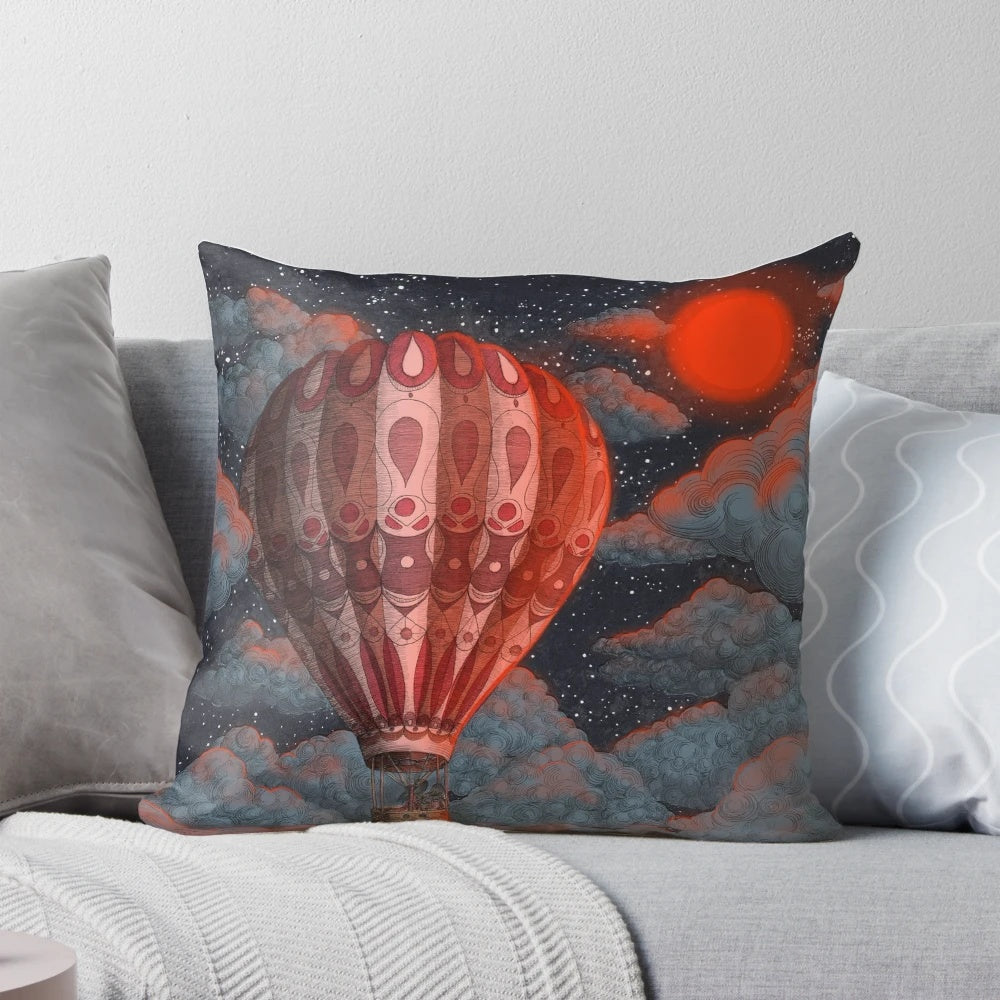 Soft, plush pillow featuring a whimsical hot air balloon design in shades of red, blue, and gold.