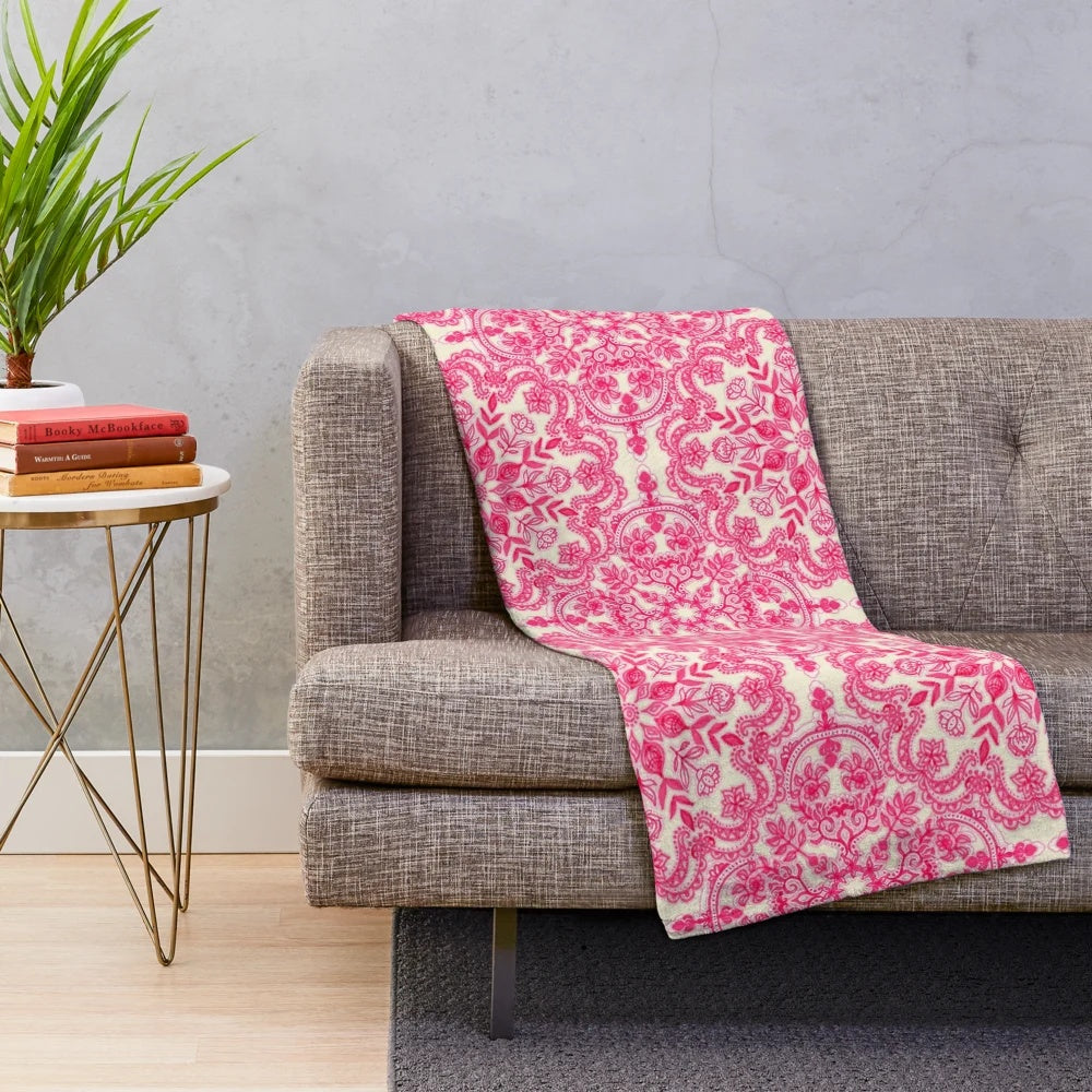 Hot pink and soft cream plush blanket with folk art pattern