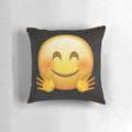 A soft, yellow pillow in the shape of a hugging emoji face, perfect for snuggling and expressing love.