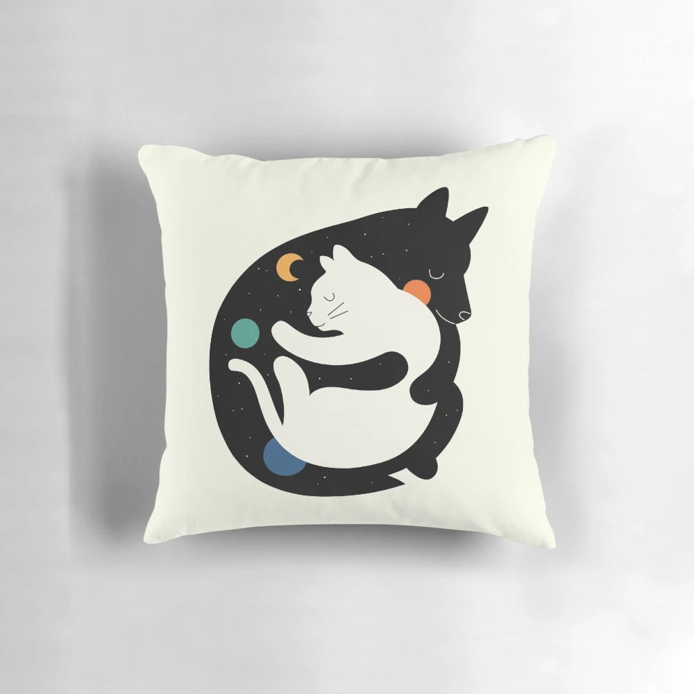 A soft, cuddly pillow with an image of two children hugging a puppy and a kitten, representing the "More Hugs Less Fights" theme.
