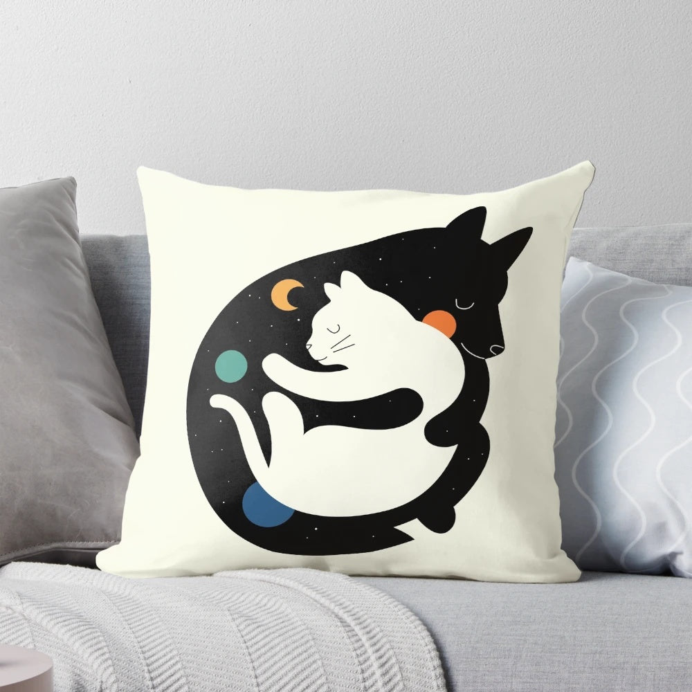 A soft, cuddly pillow with an image of two children hugging a puppy and a kitten, representing the "More Hugs Less Fights" theme.