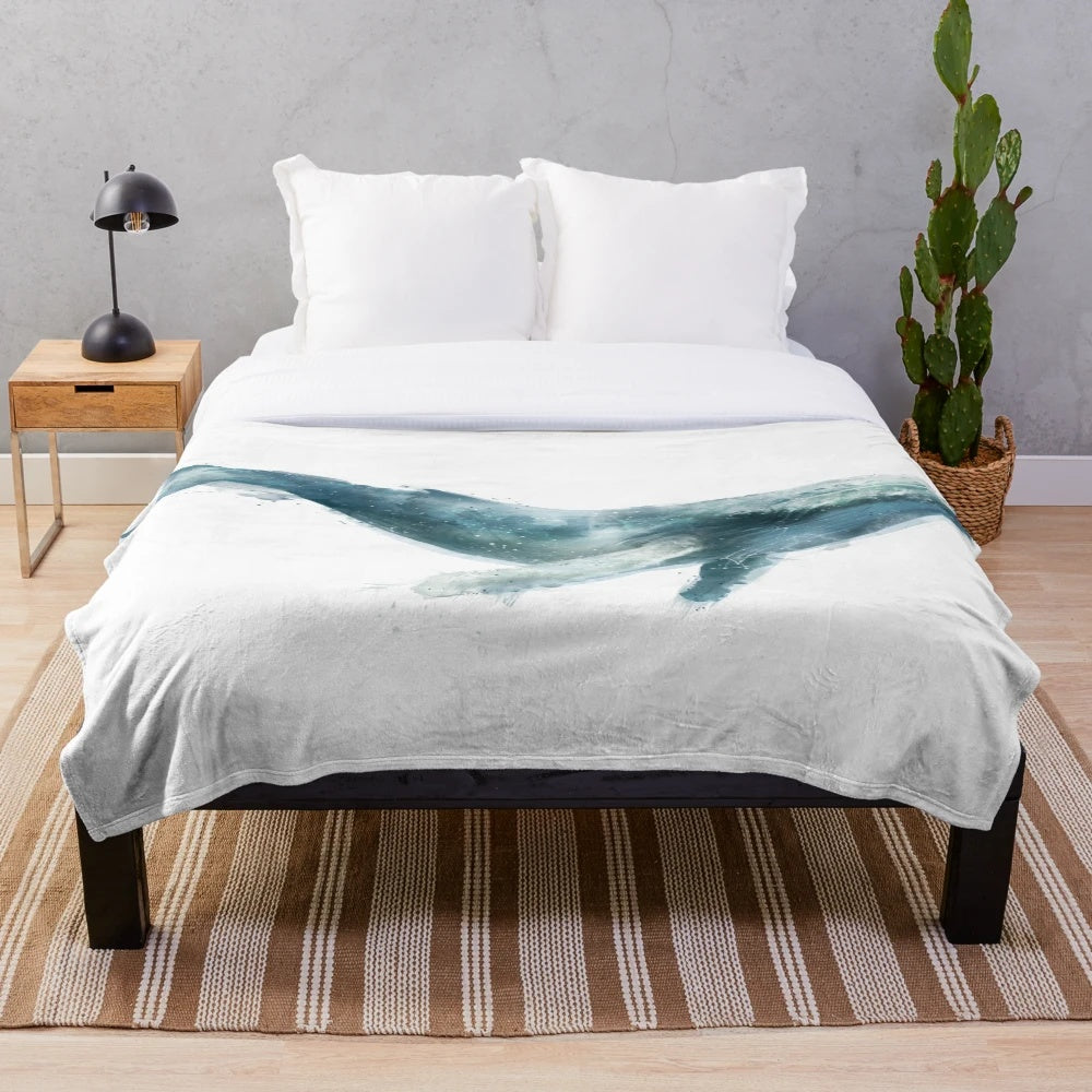 Humpback whale plush blanket providing a cozy and nature-inspired touch to any space
