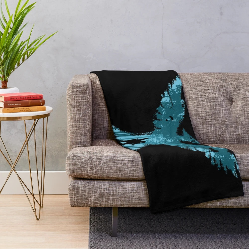 Plush blanket featuring a silhouette design inspired by the Hunger Games book and movie series