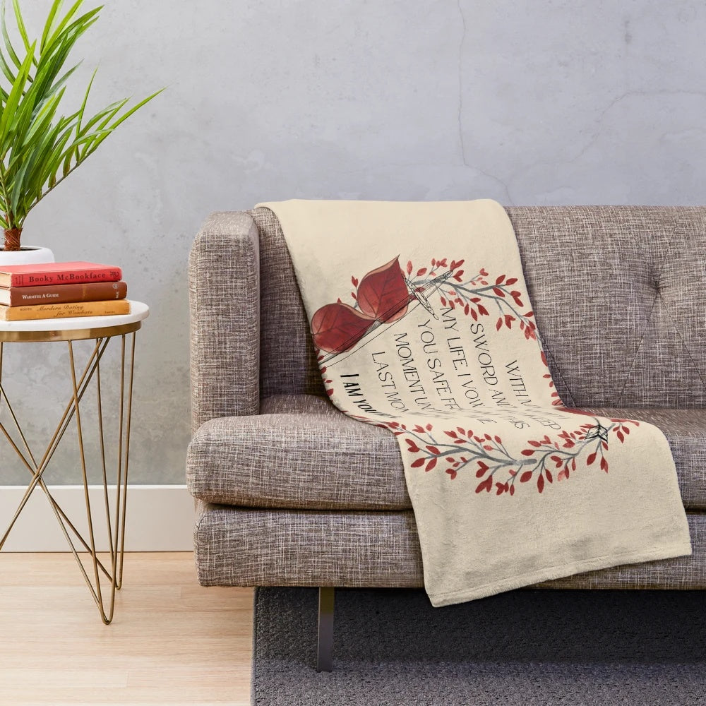 Cozy plush blanket featuring a quote from the book "From Blood and Ash