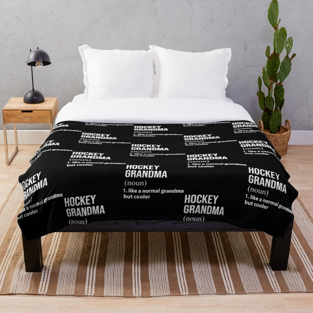 Plush blanket featuring an ice hockey grandparent design