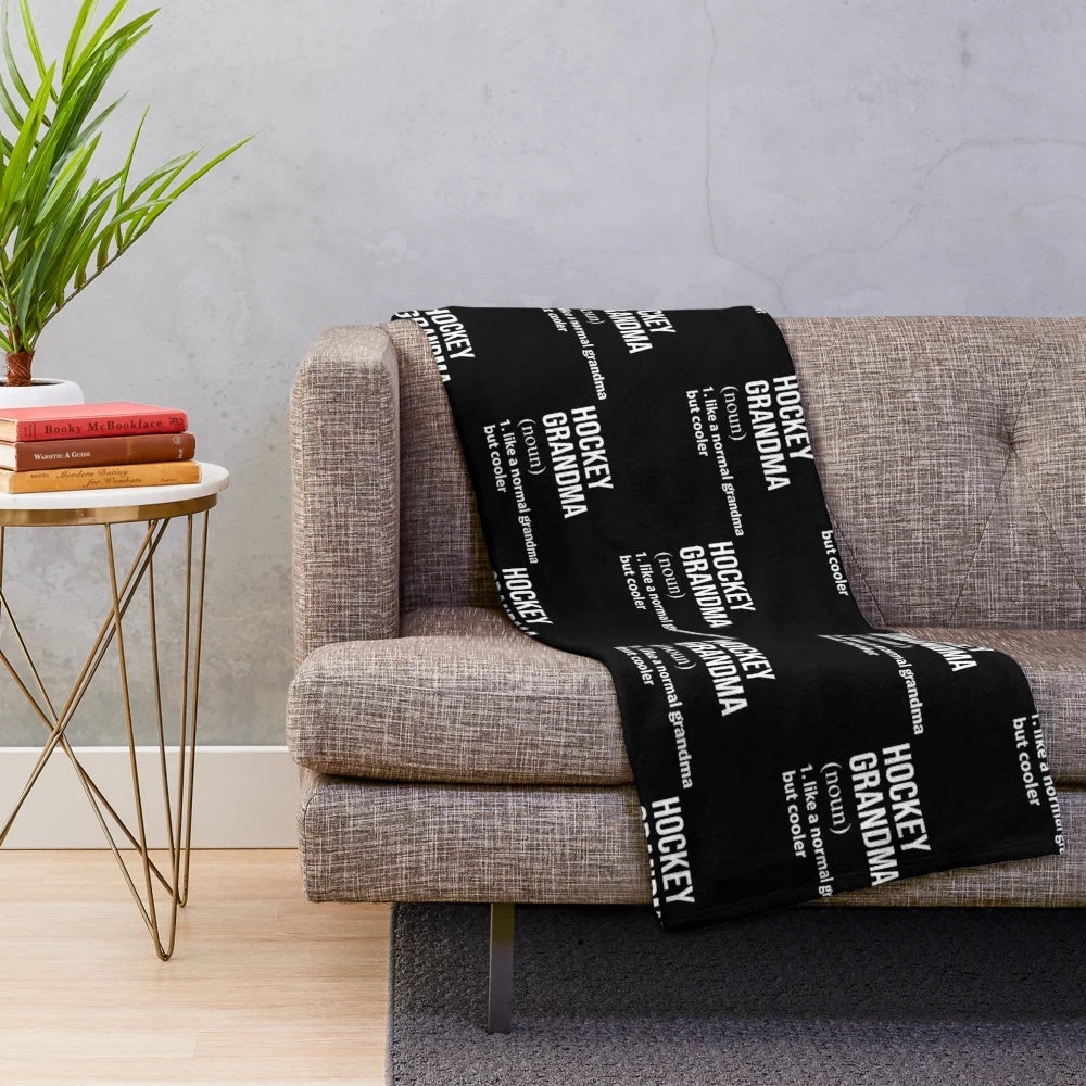 Plush blanket featuring an ice hockey grandparent design