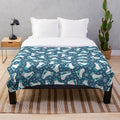 Plush blanket featuring ice skates and snowflakes design